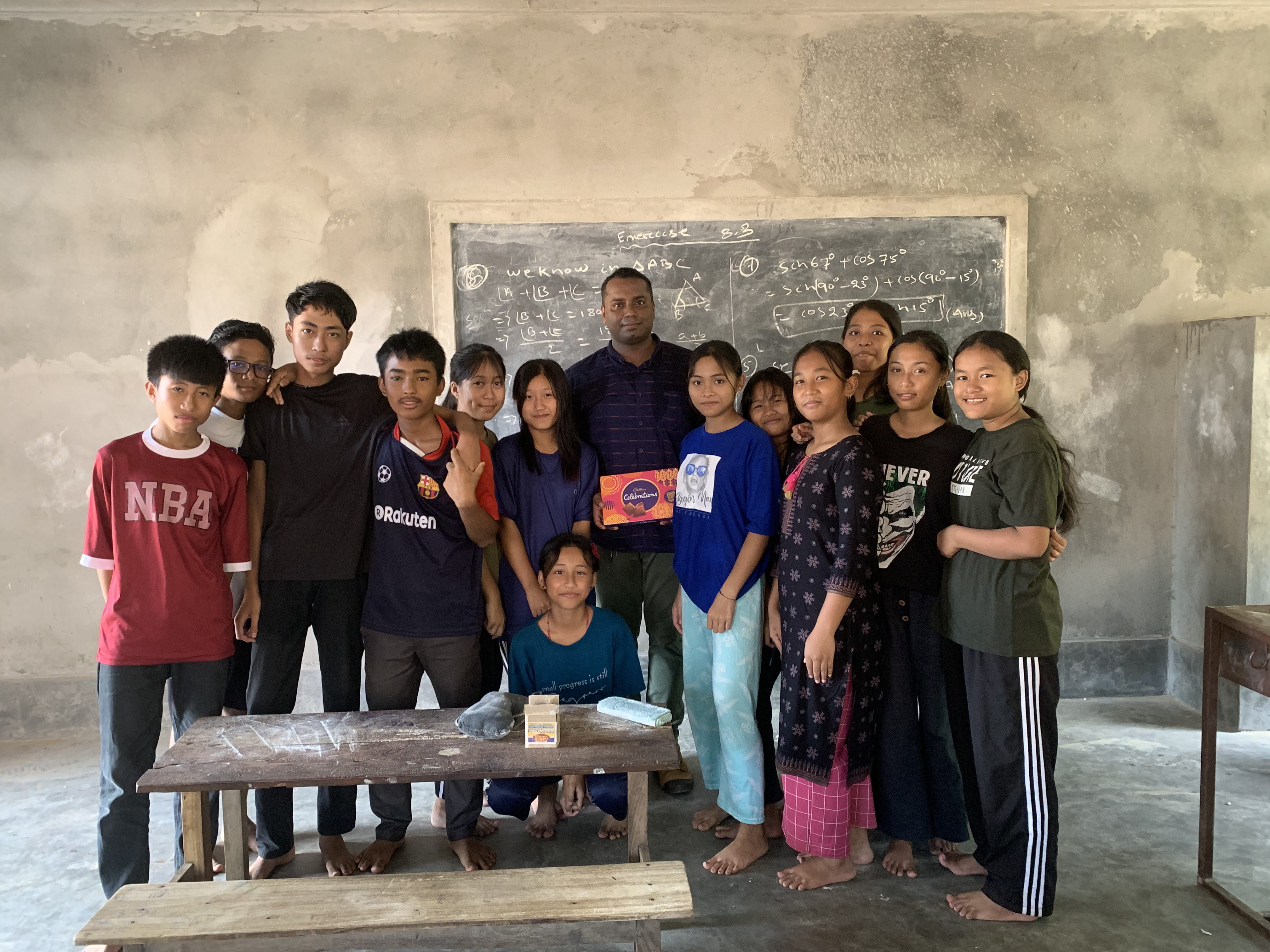 Dr Suvendu Mohanty teaching mathematics to tribal students in a village classroom in Tripura