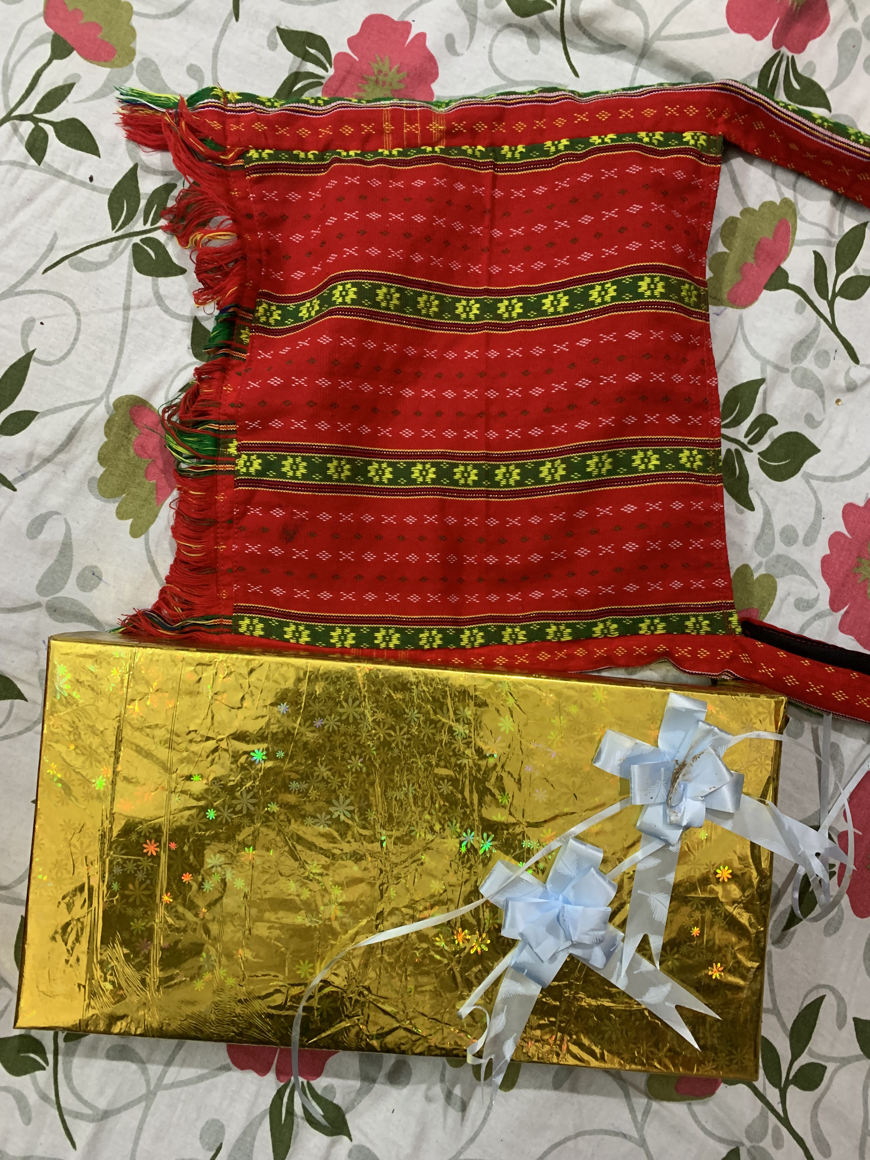 Traditional hand-woven Tripuri risa presented as a gift by students