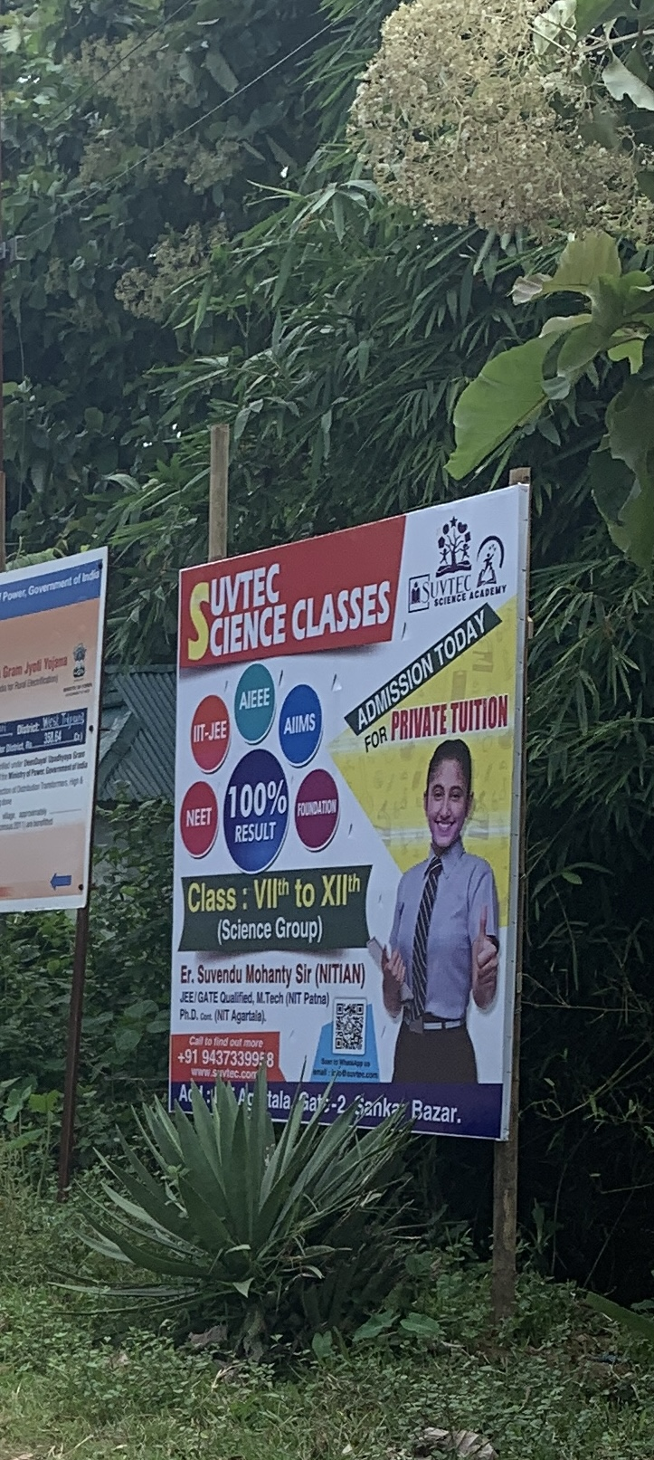 SUVTEC Science Classes roadside banner offering tuition for classes VII to XII